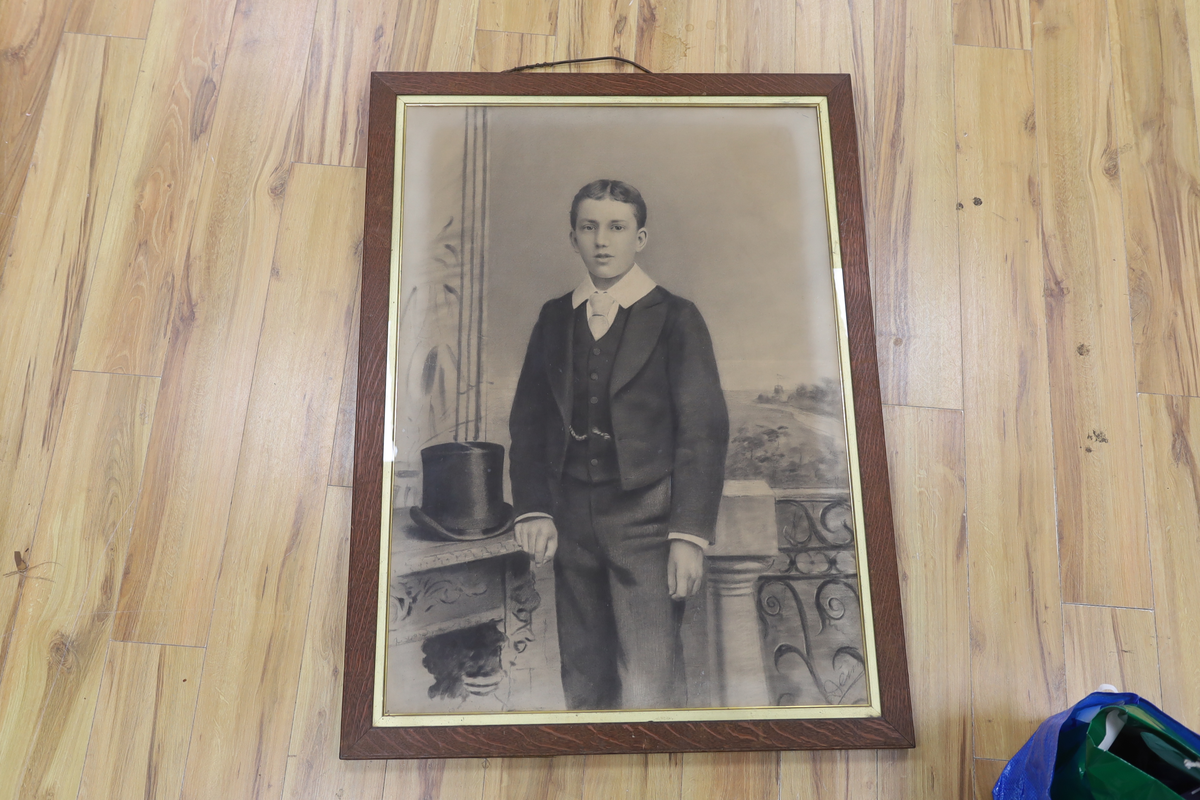 Early 20th century, charcoal, Three-quarter length portrait of a young boy, indistinctly signed lower right, 110 x 77cm